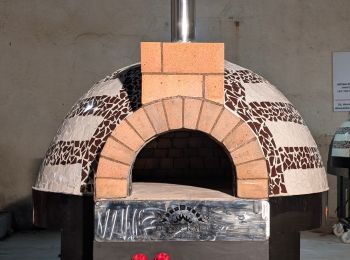 Baking pizza in traditional brick oven