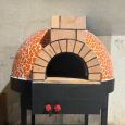Chef using wood-fired oven